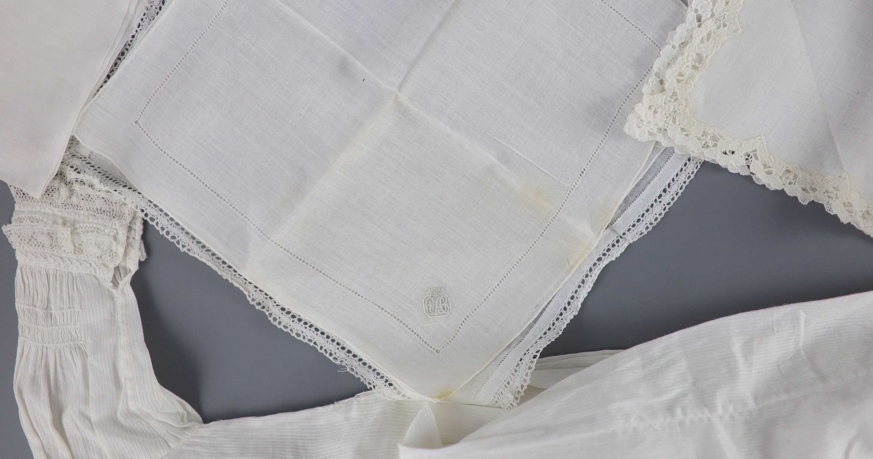 A silk coverlet embroidered 1701 with W initial as a centred cartouche,